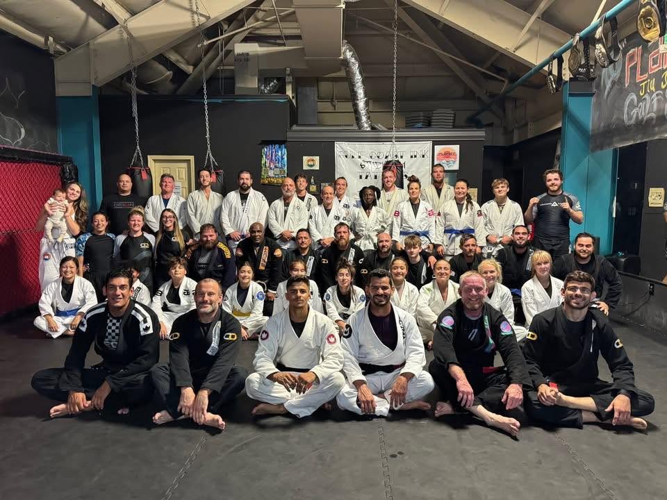 Gulf Shores BJJ kids, adults, and coaches gathered on the mats